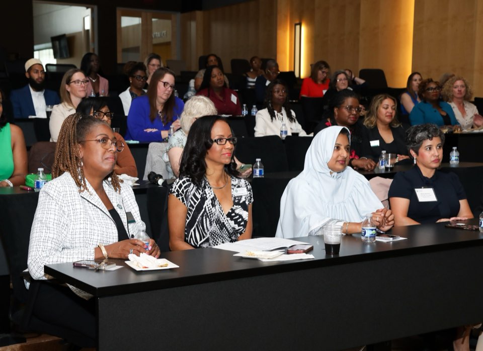 The members and guests in auditorium