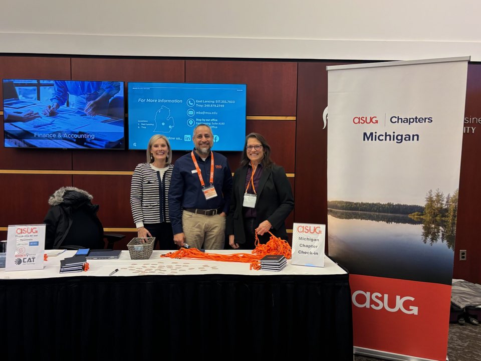 ASUG Michigan leaders at check-in table