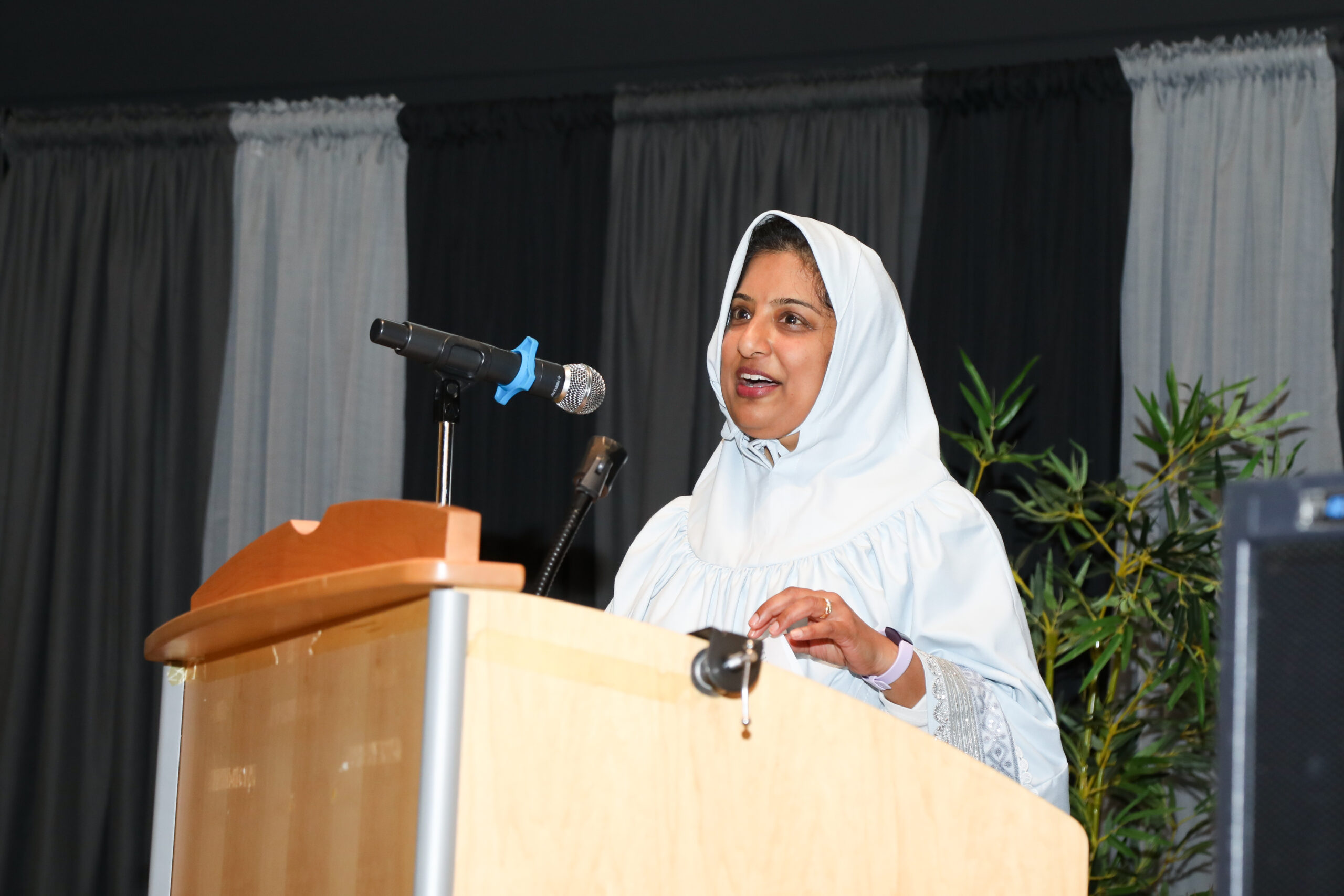 Mariyah Saifuddin at podium
