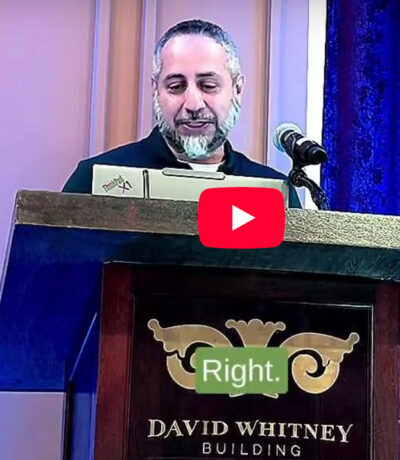 Mustansir Saifuddin at lectern